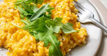 Plate of butternut squash risotto with fork