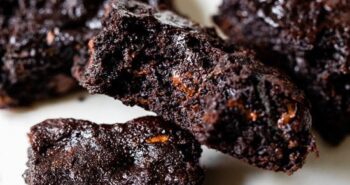 Flourless Zucchini Brownies piled on parchment paper