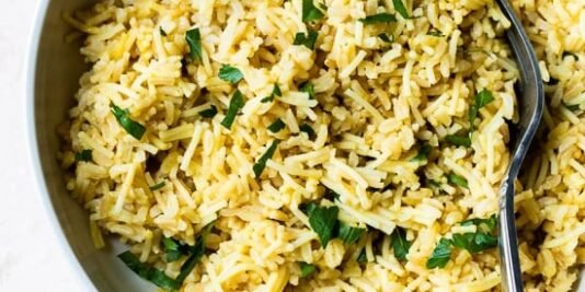 Bowl of rice pilaf with fork.